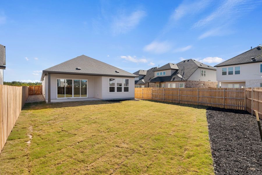 Exterior details and patio area of a home in Heritage, Dripping Springs (Image 23).
