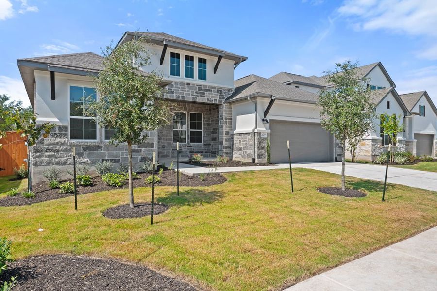 Front exterior of a new home in Capitol Collection at Lariat, Liberty Hill, TX, highlighting curb appeal (Image 27).