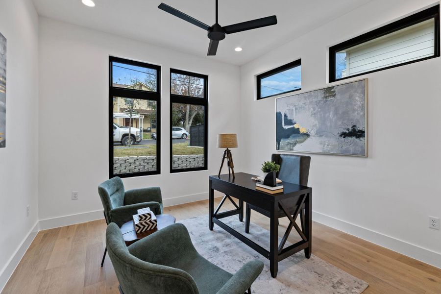 Office area featuring a ceiling fan, recessed lighting, light wood-style floors, and baseboards
