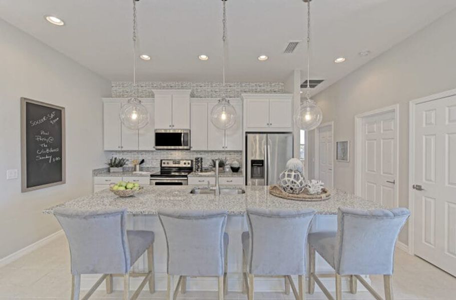 Representative furnished interior of a home built from the Harbour by Medallion Home in The Willows, Parrish (Image 7).