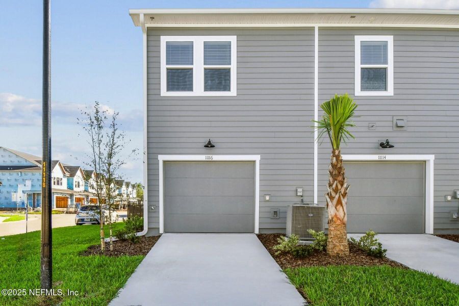 Exterior details and patio area of a home in Kettering at eTown - Garden Collection, Jacksonville (Image 2). Exterior details and patio area of a home in Kettering at eTown - Garden Collection, Jacksonville (Image 2).