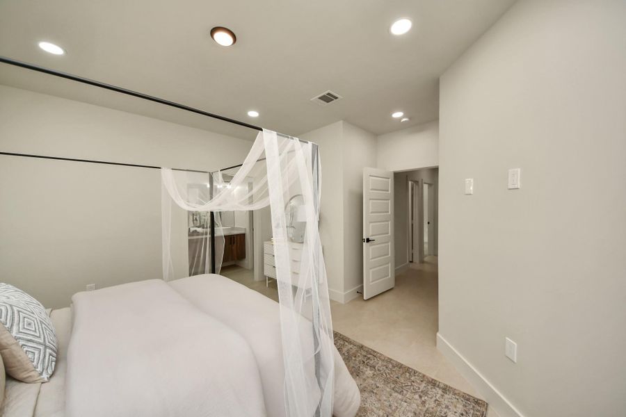 Every corner of the primary suite reflects custom quality and comfort.