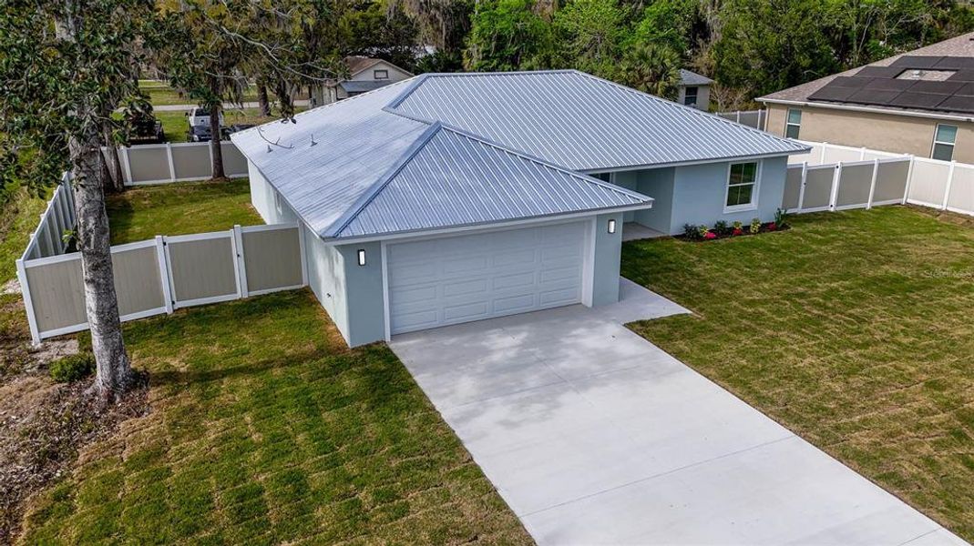 Front exterior of a new home in , Bunnell, FL, highlighting curb appeal (Image 27).
