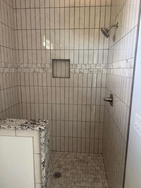 Full bathroom featuring a walk in shower