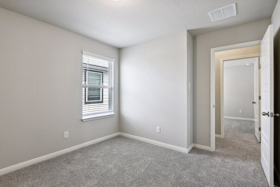 Guest bedroom in the Medina floorplan at a Meritage Homes community.