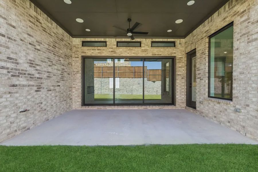 Exterior details and patio area of a home in The Grove Frisco, Frisco (Image 4). Exterior details and patio area of a home in The Grove Frisco, Frisco (Image 4).