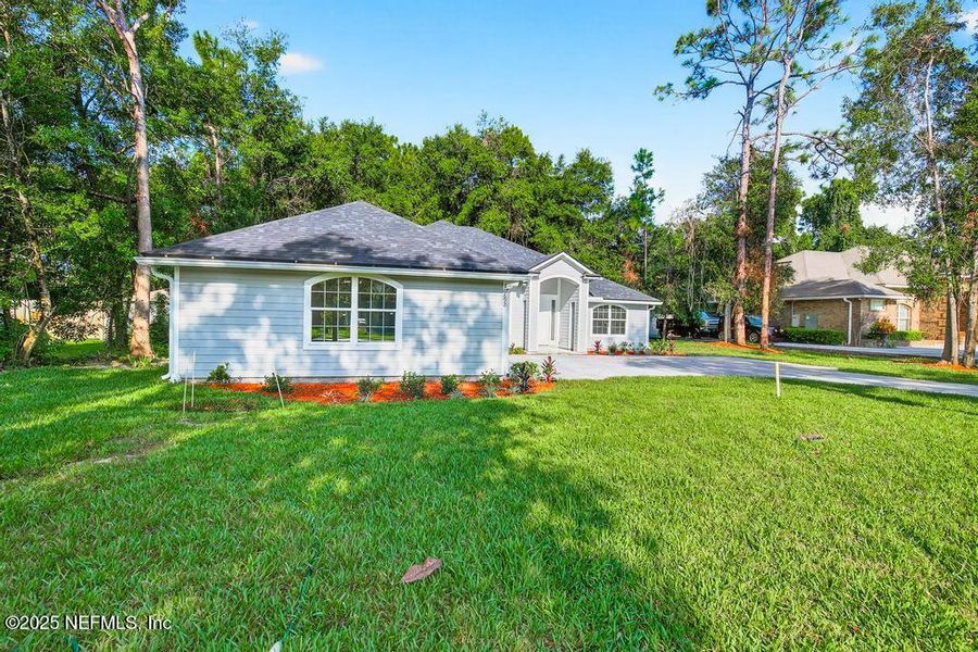 Front exterior of a new home in , Jacksonville, FL, highlighting curb appeal (Image 1). Front exterior of a new home in , Jacksonville, FL, highlighting curb appeal (Image 1).