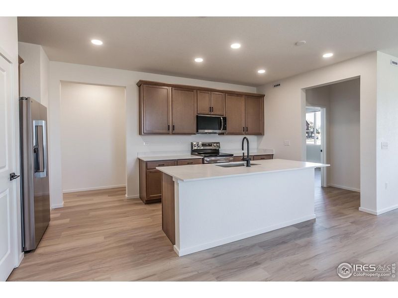 Furnished interior view inside a new home in Bloom Trailblazer Collection - Single Family Homes, Fort Collins (Image 13).
