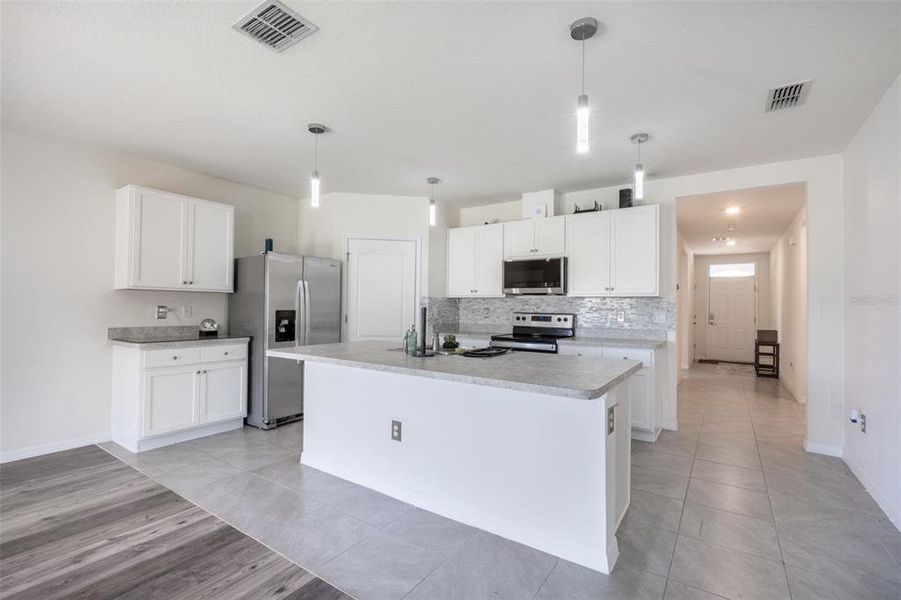 Furnished interior view inside a new home in Poinciana Enclave, Kissimmee (Image 6).