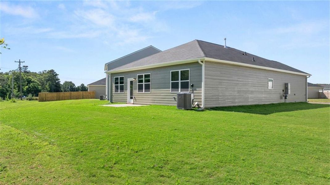 Exterior details and patio area of a home in The Preserve at Agricultural Village, Perry (Image 15).