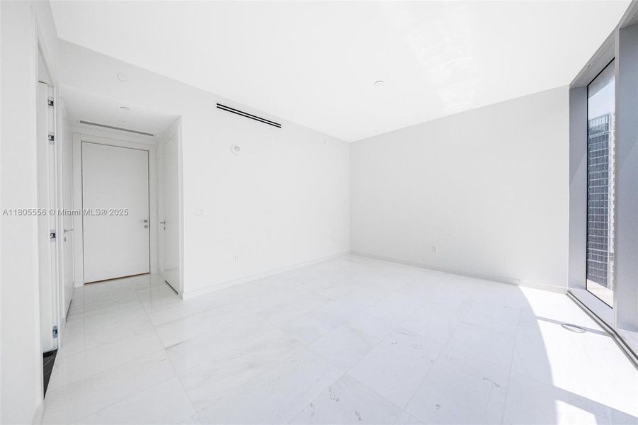 Spacious, unfurnished interior of a new home in Aston Martin Residences, Miami (Image 12).