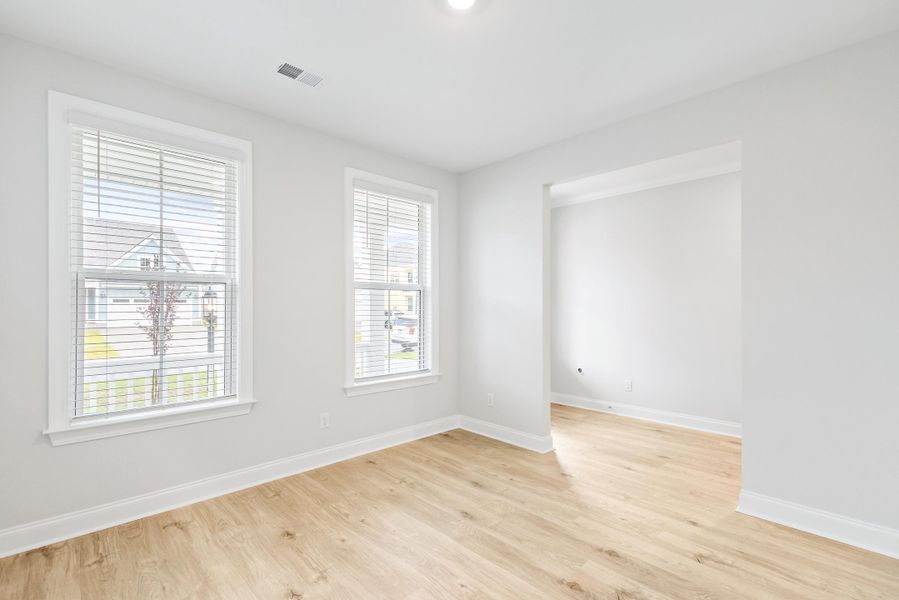 Spacious, unfurnished interior of a new home in Tidewater at Lakes of Cane Bay, Summerville (Image 28).