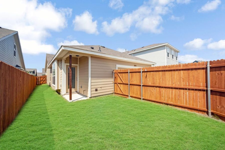Representative exterior photo of a completed home built from the Bastrop by Impression Homes in Heartland, Heartland, TX (Image 25).