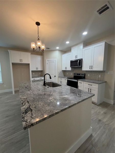 Furnished interior view inside a new home in , Conroe (Image 11).