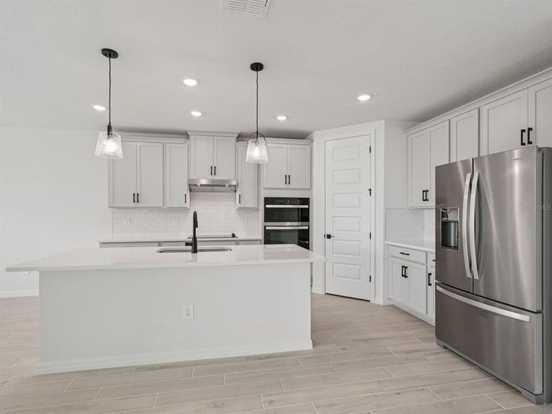 Furnished interior view inside a new home in Oakfield Trails - Signature Series, Parrish (Image 6). Furnished interior view inside a new home in Oakfield Trails - Signature Series, Parrish (Image 6).