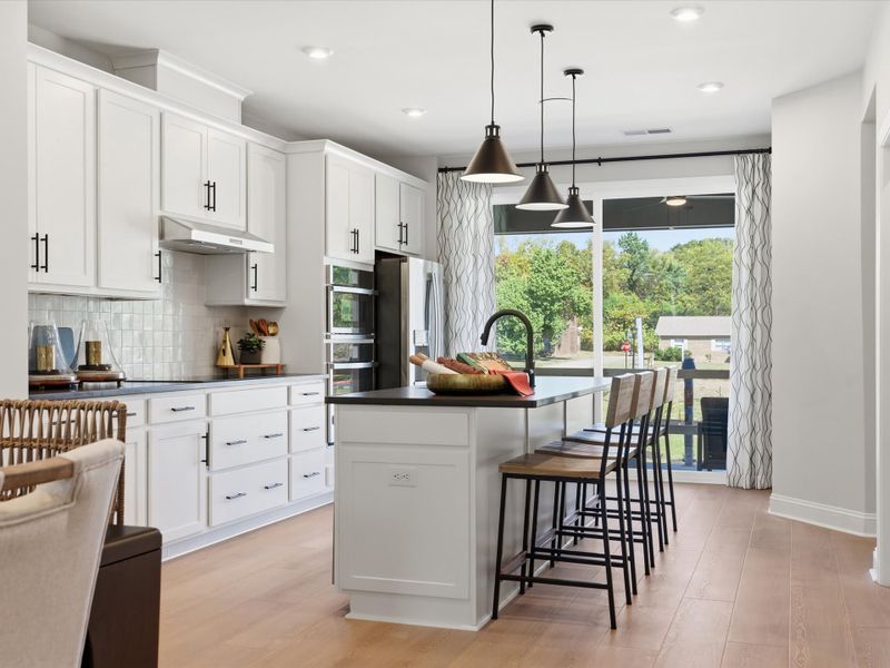 Representative furnished interior of a home built from the Dahlia by Tri Pointe Homes in Bellflower, Charlotte (Image 39).