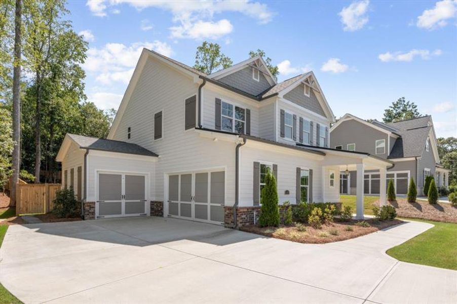 Front exterior of a new home in Arden on Lanier, Cumming, GA, highlighting curb appeal (Image 16).