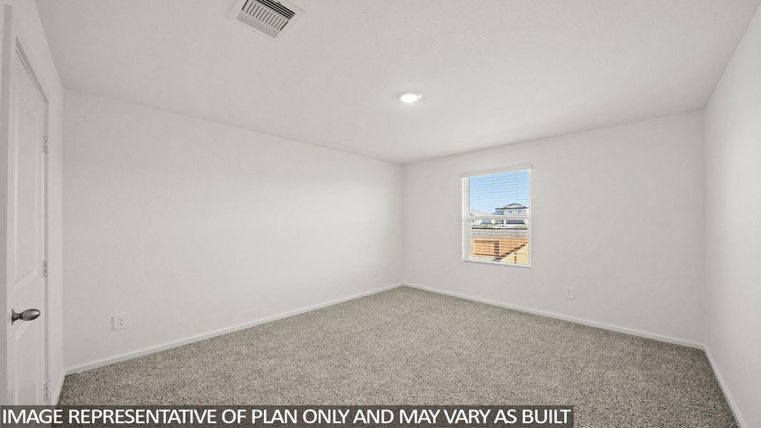 A well-lit, neutral interior space with comfortable carpeting awaits your personal touch.