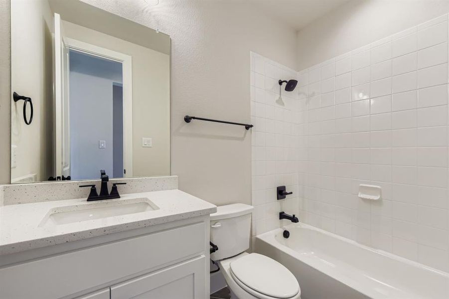 Full bathroom with bathing tub / shower combination and vanity