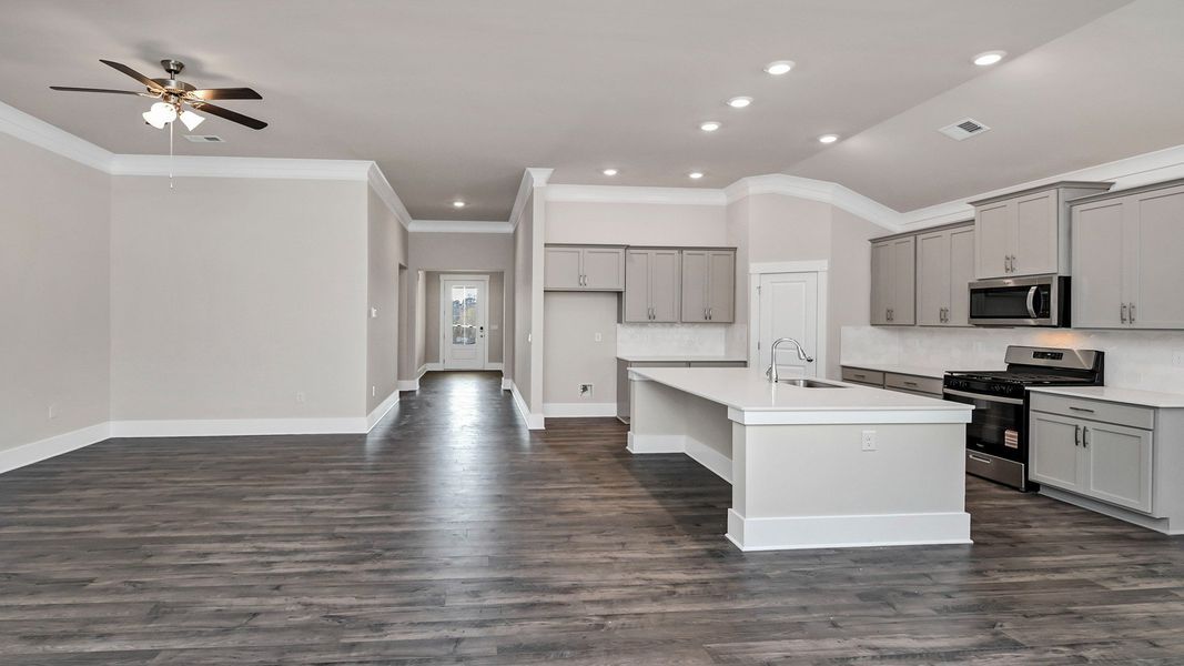 Representative furnished interior of a home built from the Litchfield by D.R. Horton in Lake Tide Summit, Chapin (Image 5).