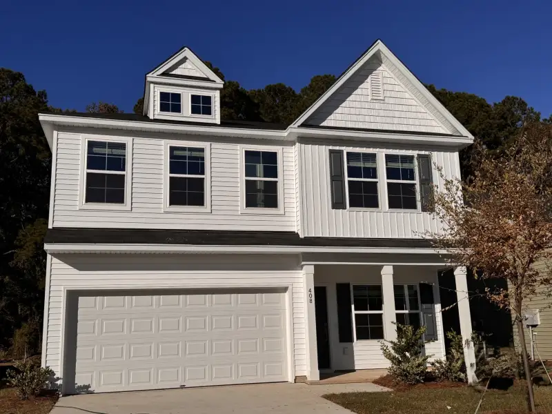 Front exterior of a new home in Six Oaks, Summerville, SC, highlighting curb appeal (Image 1). Front exterior of a new home in Six Oaks, Summerville, SC, highlighting curb appeal (Image 1).