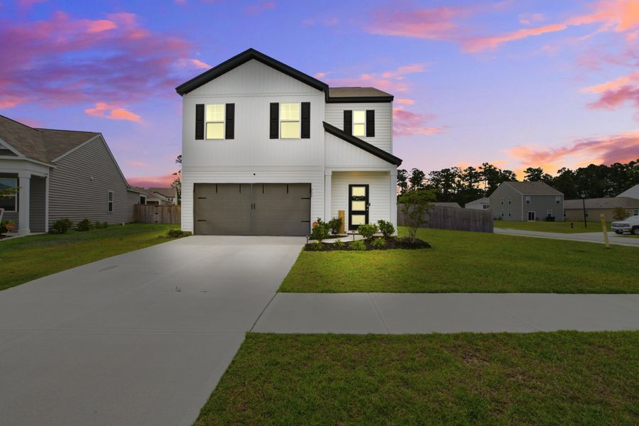 Front exterior of a new home in , Summerville, SC, highlighting curb appeal (Image 1). Front exterior of a new home in , Summerville, SC, highlighting curb appeal (Image 1).