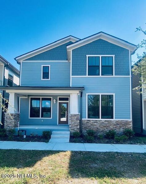 Front exterior of a new home in , Jacksonville, FL, highlighting curb appeal (Image 1).