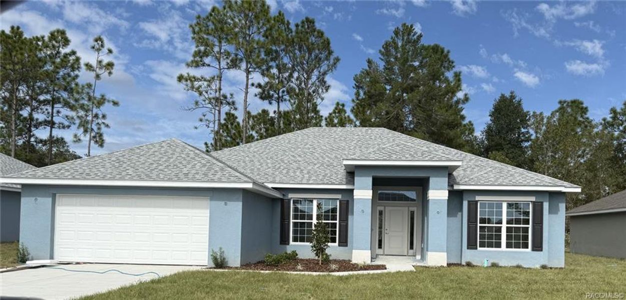 Front exterior of a new home in The Pines at Citrus Springs, Citrus Springs, FL, highlighting curb appeal (Image 1).