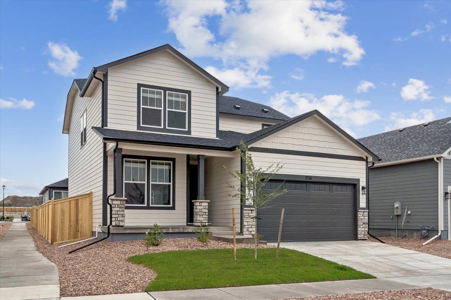 Front exterior of a new home in Aspen Meadows-4, Colorado Springs, CO, highlighting curb appeal (Image 2). Front exterior of a new home in Aspen Meadows-4, Colorado Springs, CO, highlighting curb appeal (Image 2).