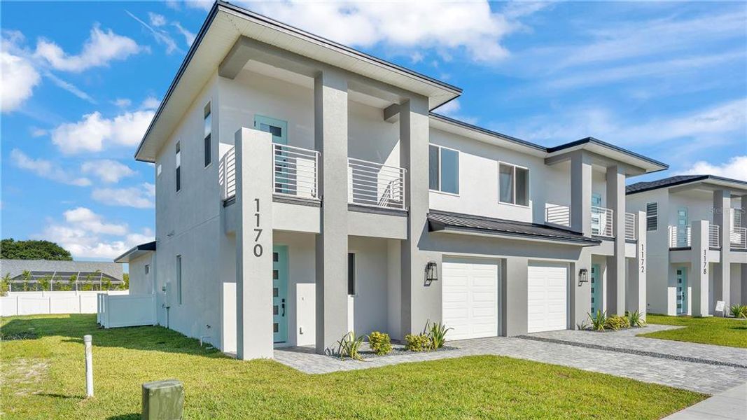 Front exterior of a new home in , Lakeland, FL, highlighting curb appeal (Image 23).