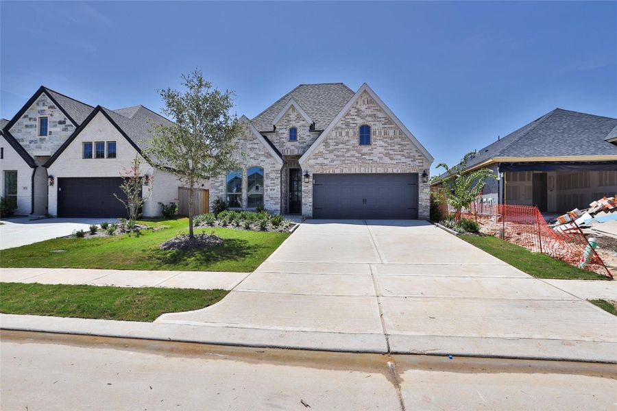 Front exterior of a new home in Everly, Hockley, TX, highlighting curb appeal (Image 2). Front exterior of a new home in Everly, Hockley, TX, highlighting curb appeal (Image 2).