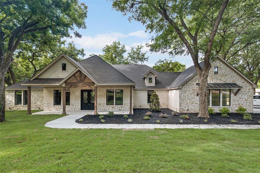 Front exterior of a new home in , Ovilla, TX, highlighting curb appeal (Image 2). Front exterior of a new home in , Ovilla, TX, highlighting curb appeal (Image 2).