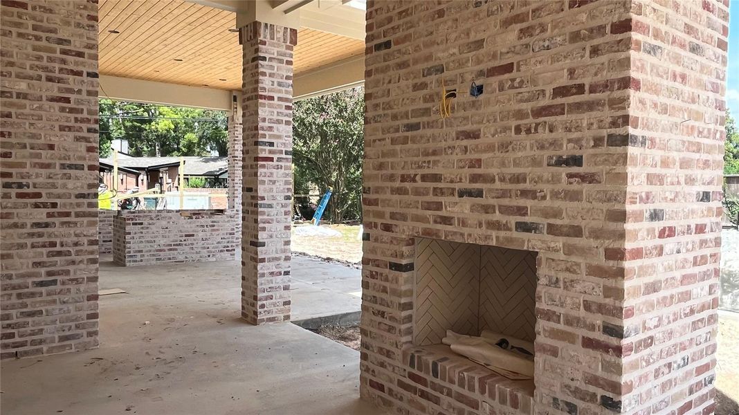 A progress photo in August 2025 showing the back patio with beautiful brickwork