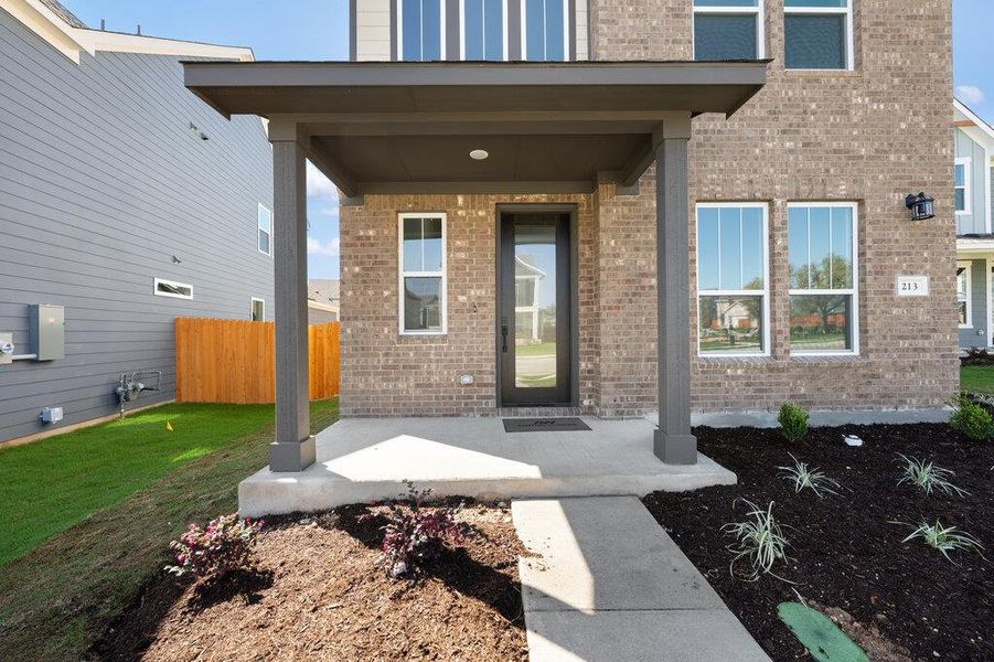 Exterior details and patio area of a home in Lariat, Liberty Hill (Image 4).