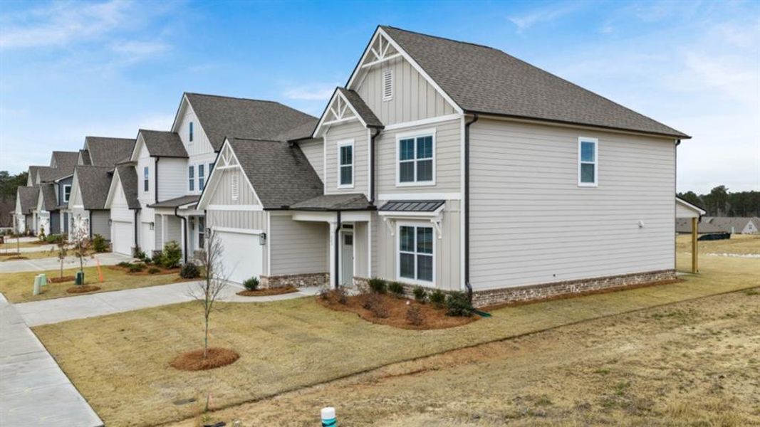 Front exterior of a new home in Hamptons at Riverwood East, Dallas, GA, highlighting curb appeal (Image 2). Front exterior of a new home in Hamptons at Riverwood East, Dallas, GA, highlighting curb appeal (Image 2).