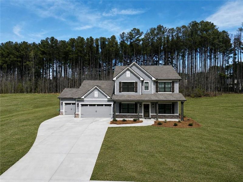 Front exterior of a new home in Weslyn Park, Social Circle, GA, highlighting curb appeal (Image 18). Front exterior of a new home in Weslyn Park, Social Circle, GA, highlighting curb appeal (Image 18).