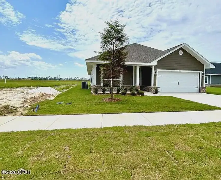 Front exterior of a new home in Parkbrook, Panama City, FL, highlighting curb appeal (Image 2). Front exterior of a new home in Parkbrook, Panama City, FL, highlighting curb appeal (Image 2).