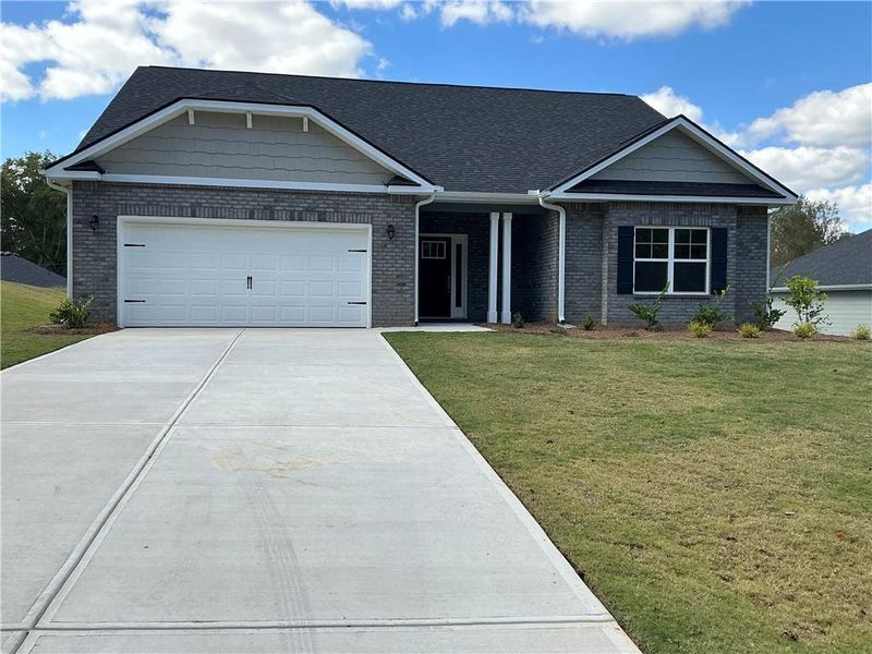 Front exterior of a new home in Park Place, Bowdon, GA, highlighting curb appeal (Image 1).