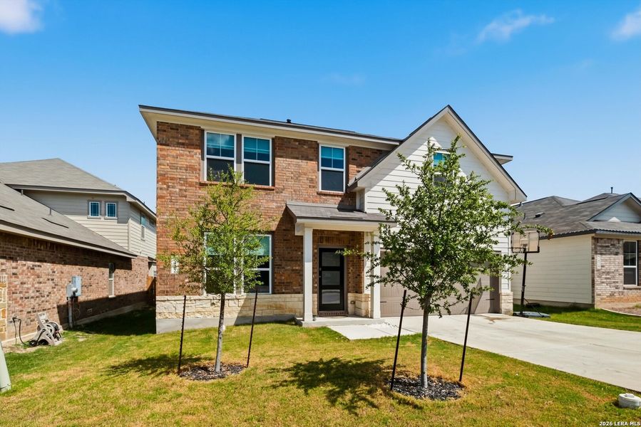 Front exterior of a new home in Horizon Pointe, Converse, TX, highlighting curb appeal (Image 23).