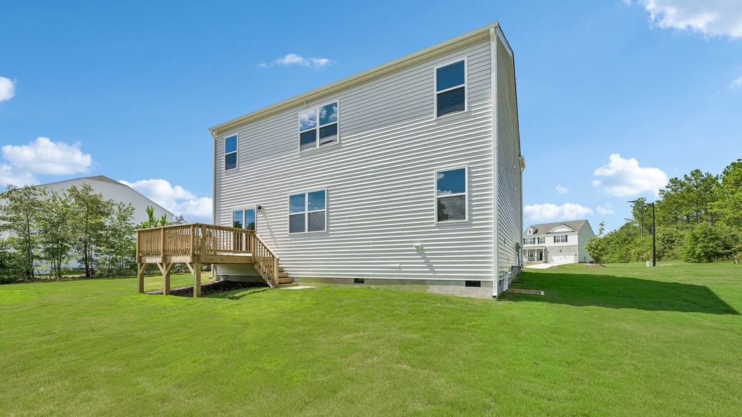 Exterior details and patio area of a home in Mason Ridge, Spring Lake (Image 4).
