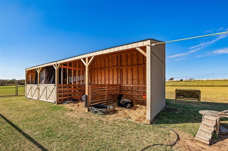 View of outbuilding with a rural view and an exterior structure View of outbuilding with a rural view and an exterior structure