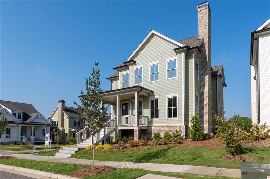 Front exterior of a new home in Crossroads, Milton, GA, highlighting curb appeal (Image 2). Front exterior of a new home in Crossroads, Milton, GA, highlighting curb appeal (Image 2).