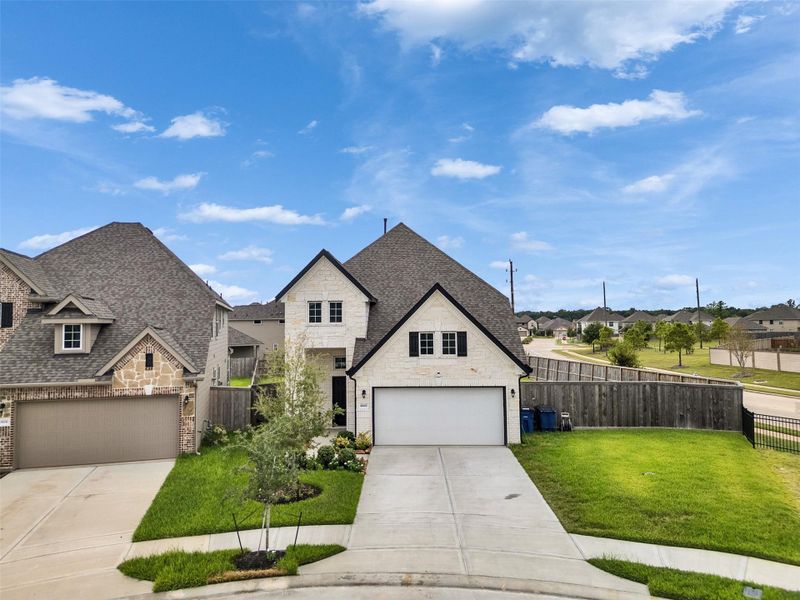 Front exterior of a new home in Park Lakes East, Humble, TX, highlighting curb appeal (Image 23).