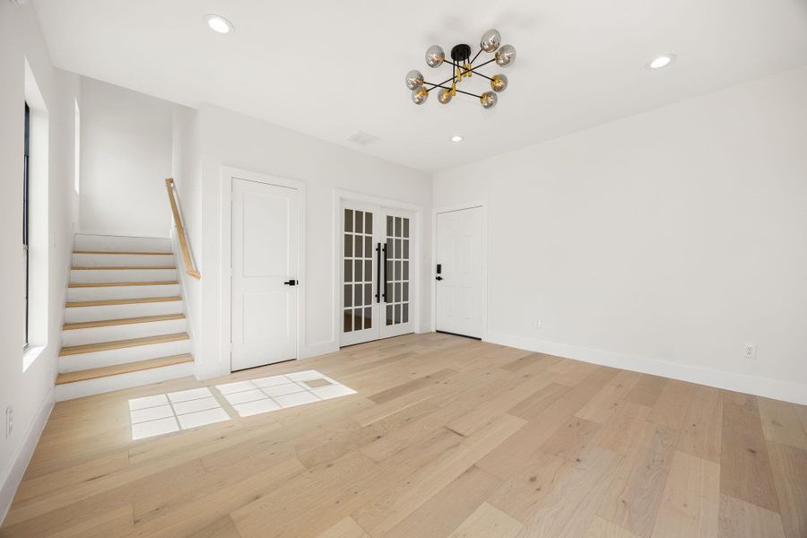 A final look at the first floor living space before heading upstairs, highlighting the open layout and seamless flow throghout the home.
