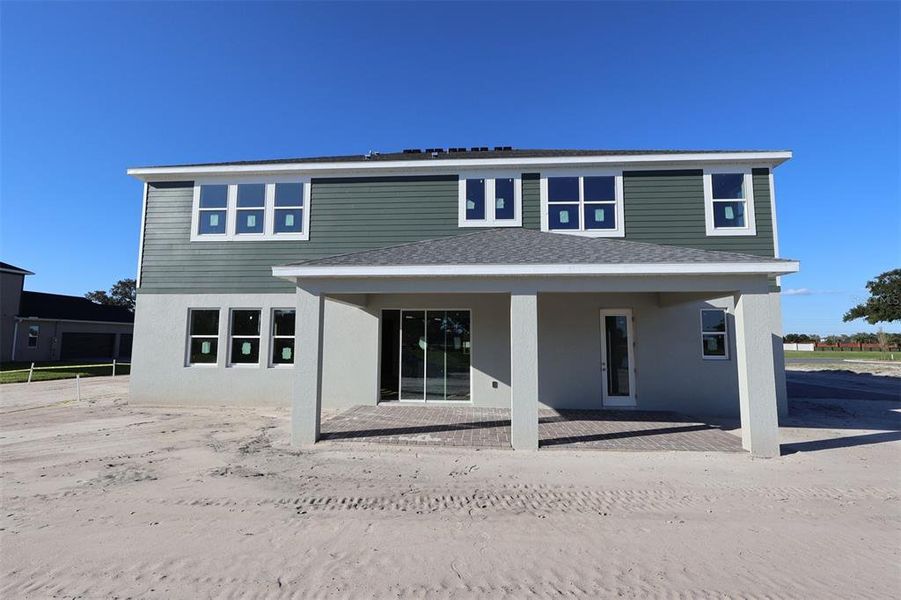 Exterior details and patio area of a home in Solace at Corner Lake, Orlando (Image 19). Exterior details and patio area of a home in Solace at Corner Lake, Orlando (Image 19).