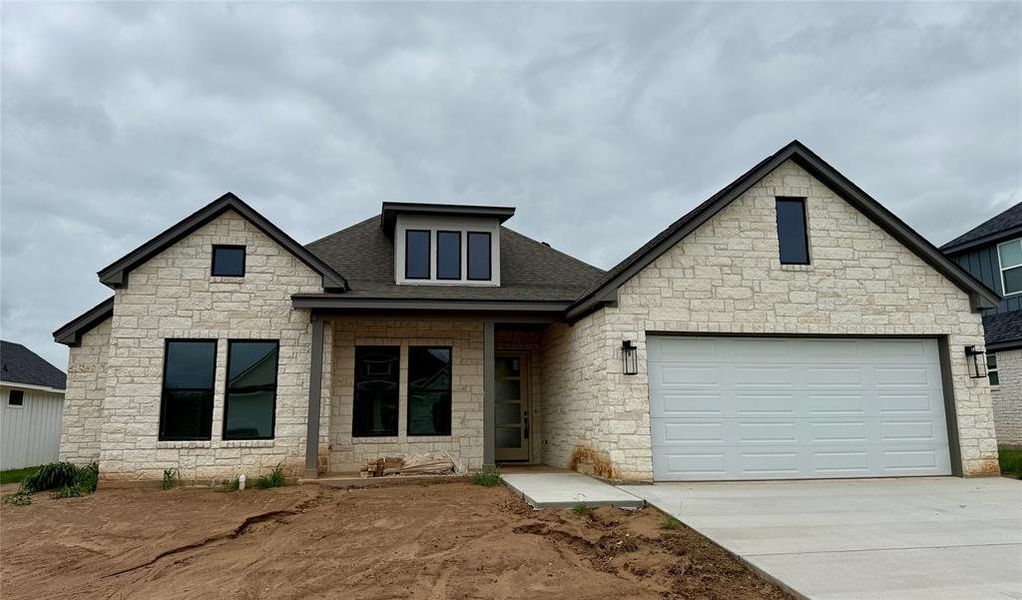 Stone veneer facade with dark trim details