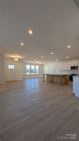 Overlook of the dining, living room and kitchen.