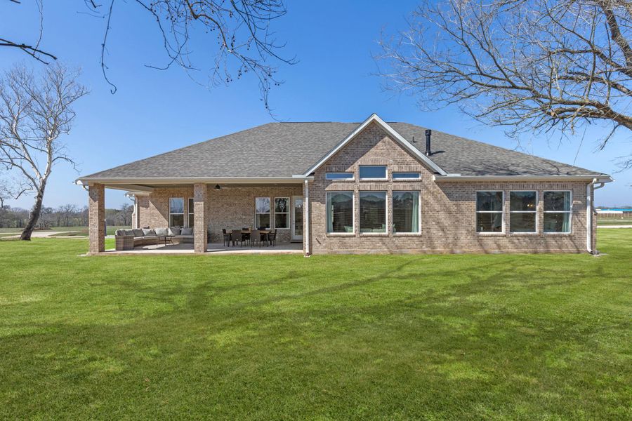 Front exterior of a new home in , Smithville, TX, highlighting curb appeal (Image 1). Front exterior of a new home in , Smithville, TX, highlighting curb appeal (Image 1).