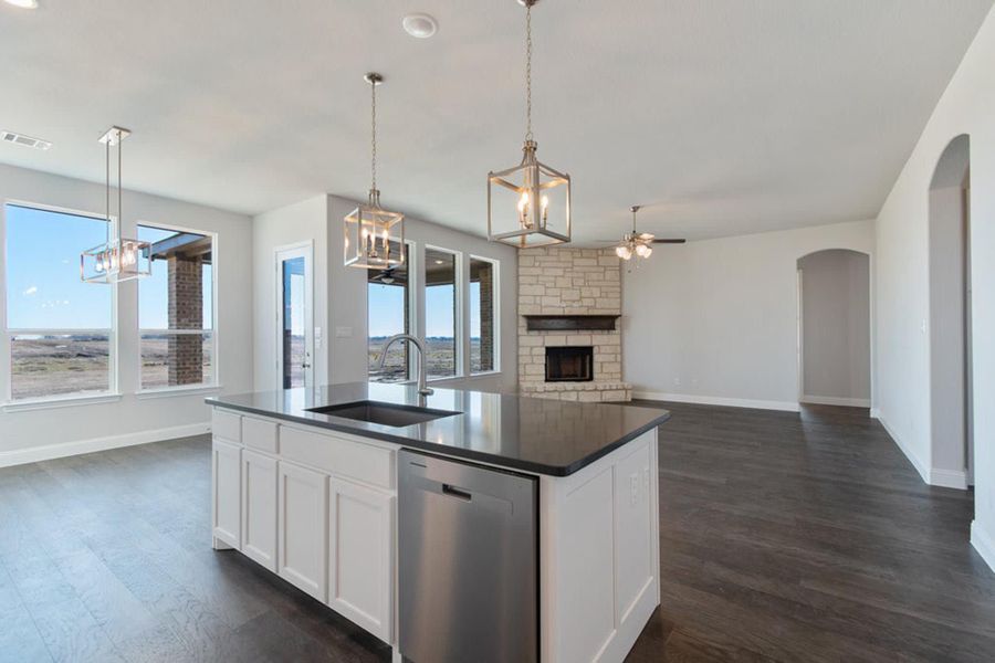 Kitchen to Family Room | Concept 2406 at The Meadows in Gunter, TX by Landsea Homes