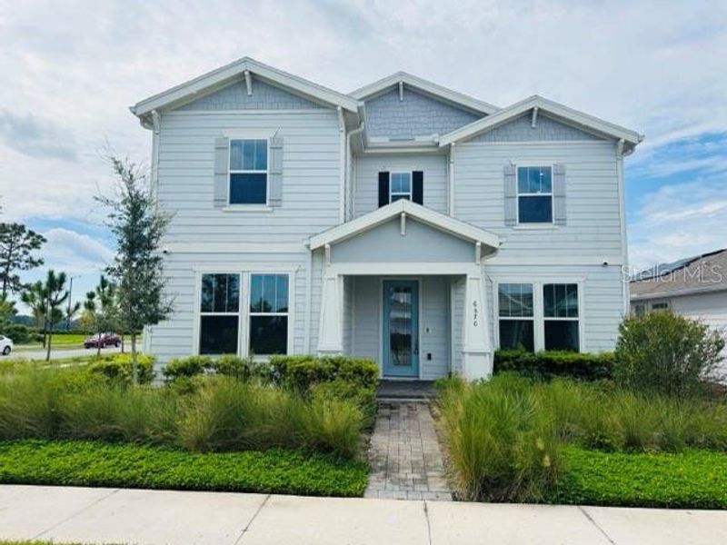 Front exterior of a new home in , St. Cloud, FL, highlighting curb appeal (Image 20).